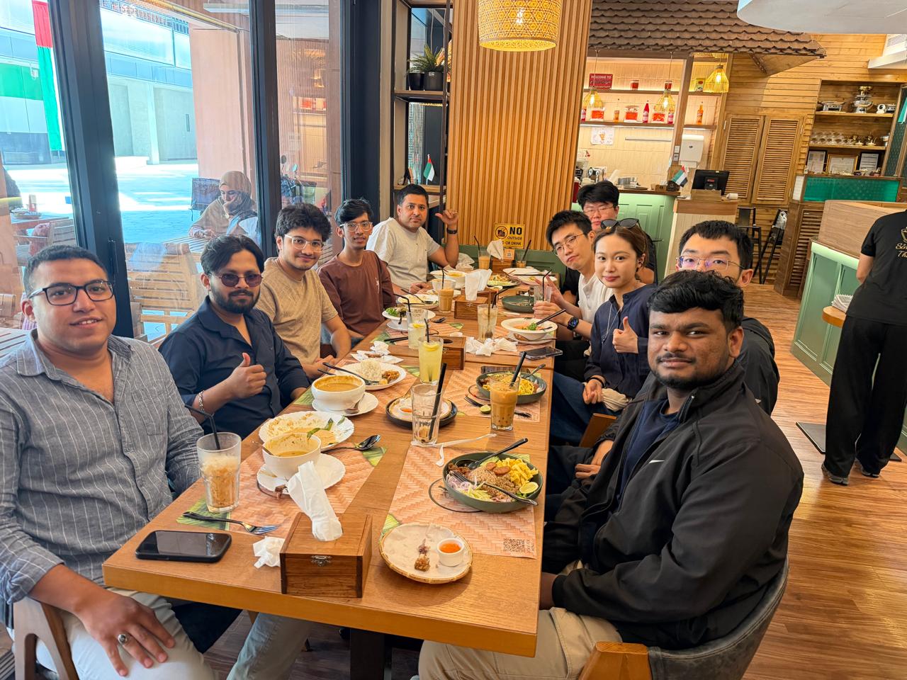 GenMI Lab members sharing a meal at a restaurant outing